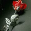 ROSA ABIERTA DE 25 CM.DE PLATA DE LEY, ESMALTADA EN ROJO
